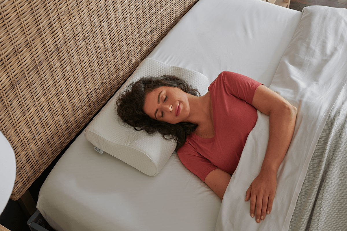 woman sleeping on a neck pillow