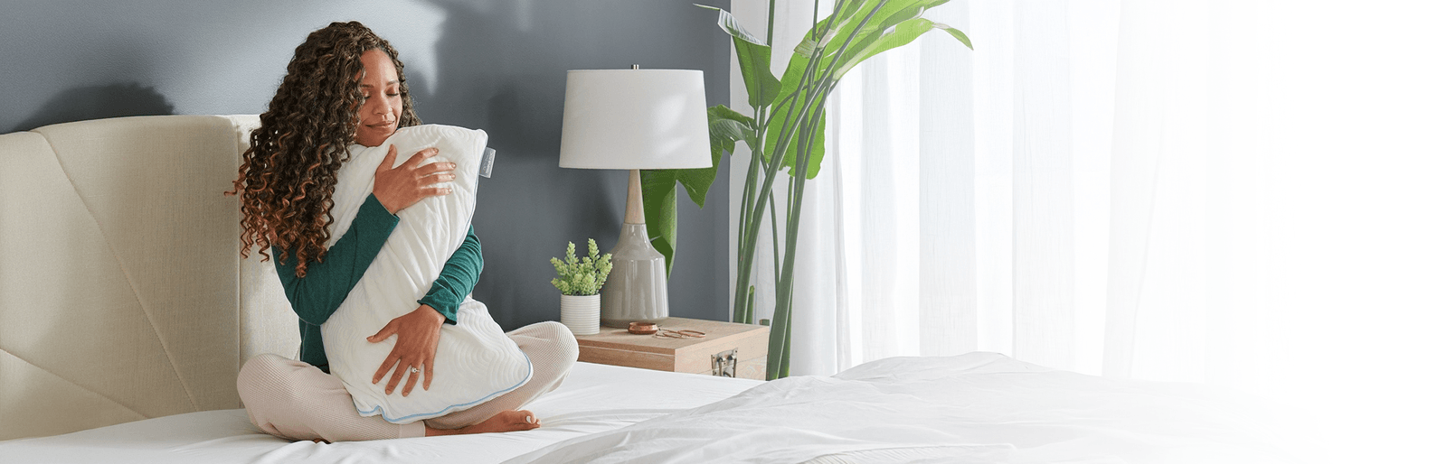 Woman hugging tempurpedic pillow