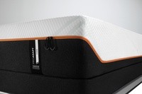 The corner of a tempur-proadapt firm mattress