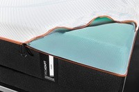 A partially unzipped and removed cover on a tempur-proadapt mattress showing the easily removable cover