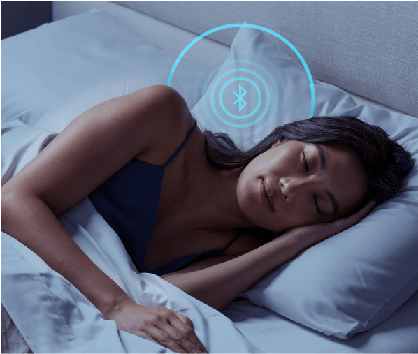 A woman sleeping on a mattress