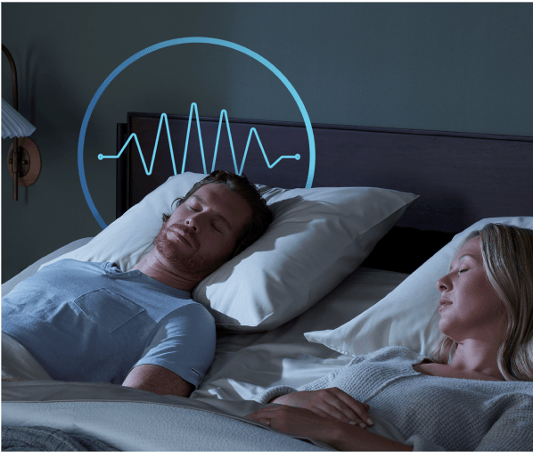 A sleeping couple on a mattress