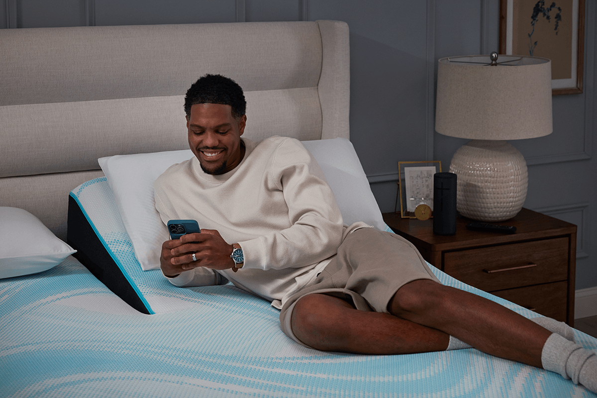 guy lounging on his split head breeze mattress
