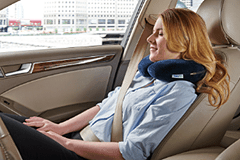 Woman using a travel neck pillow