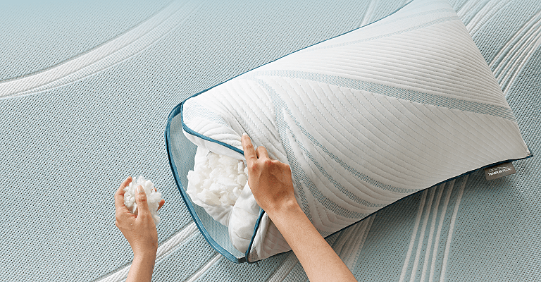 Person filling in an Adapt Adjustable pillow