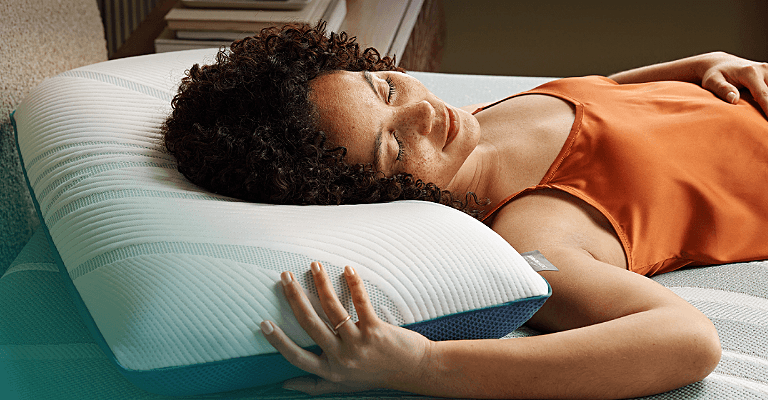 Woman sleeping on an Adapt mattress on an Adapt pillow
