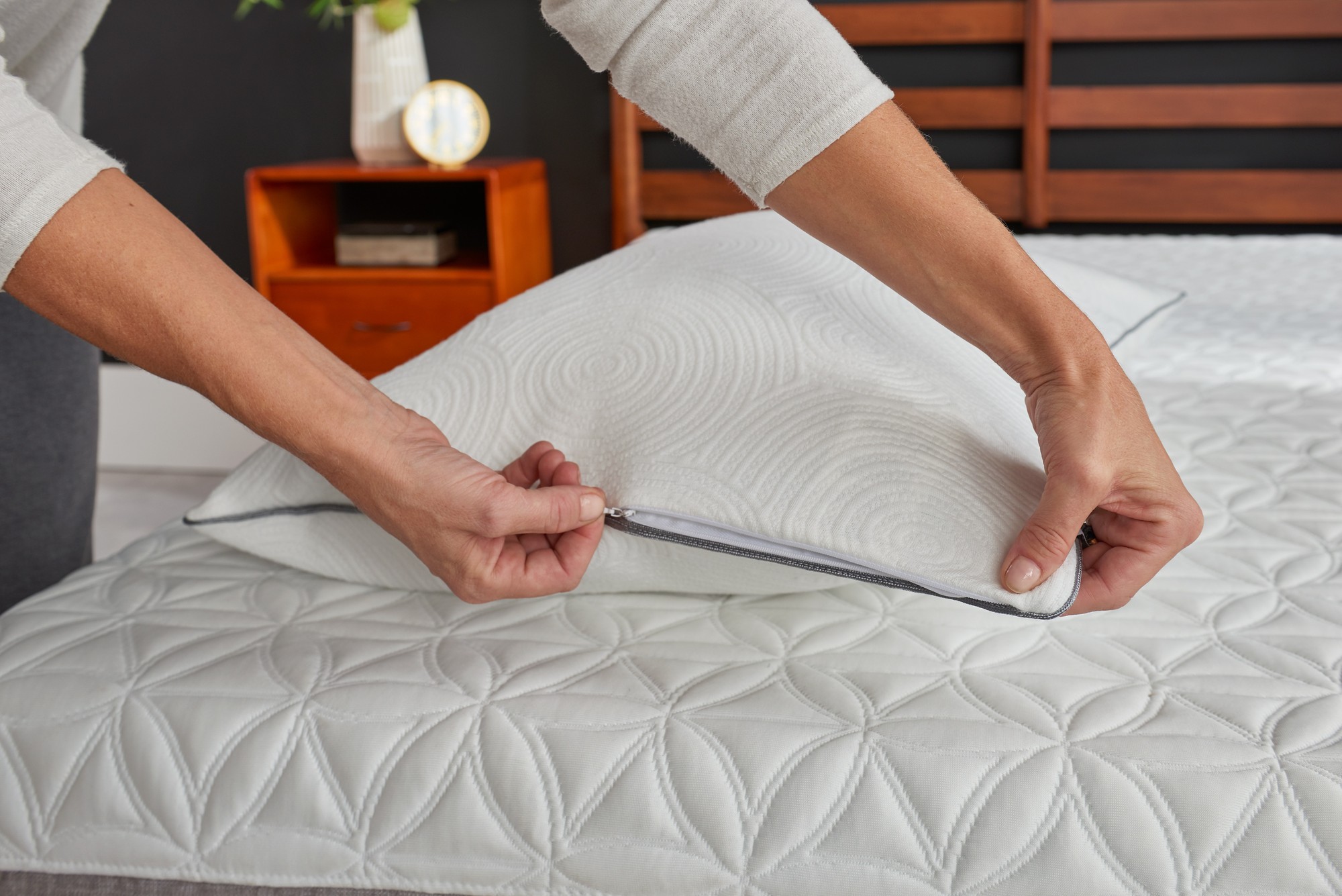 Close up of removable tempur pillow protector being unzipped