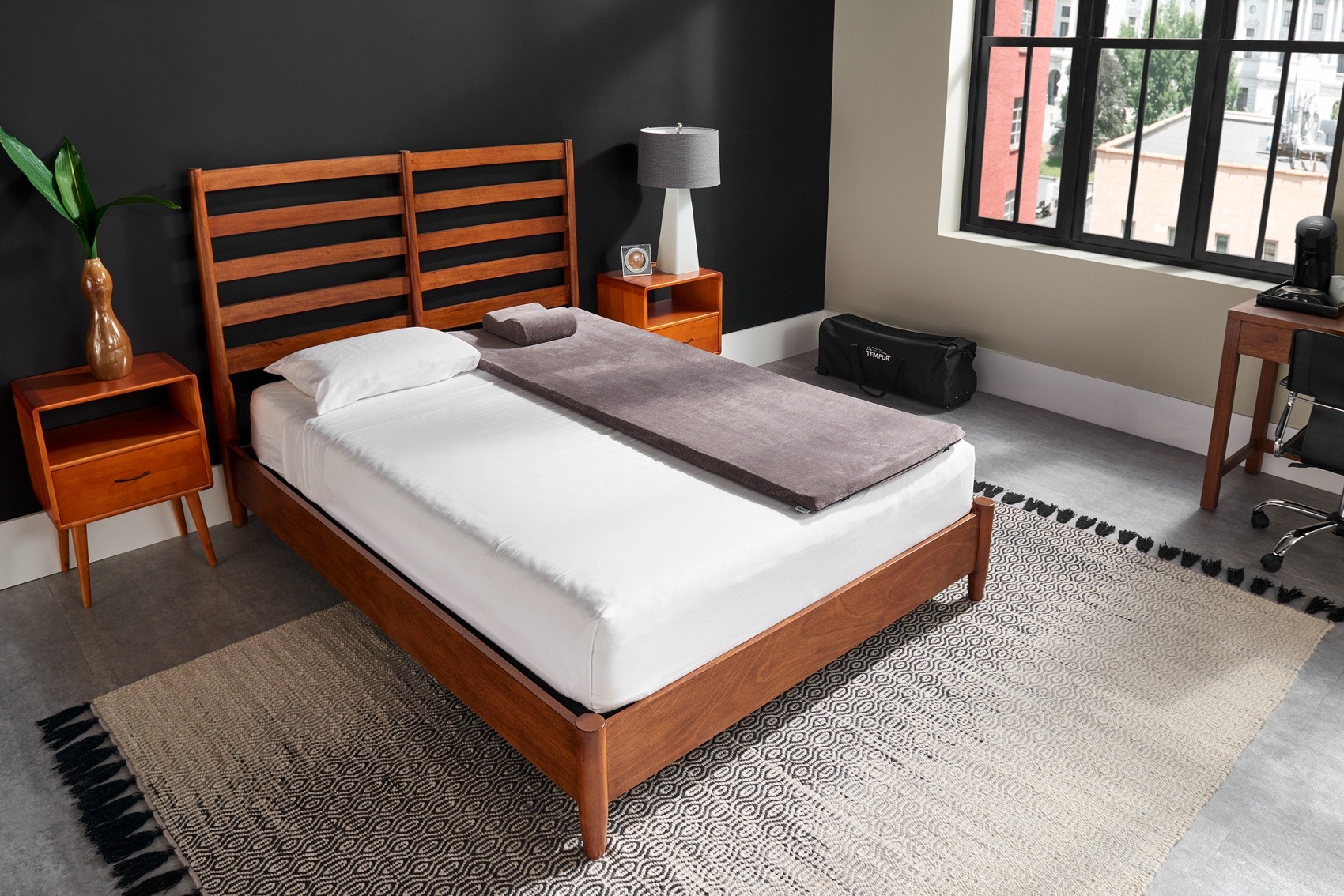 An unpacked travel set laid out on a mattress