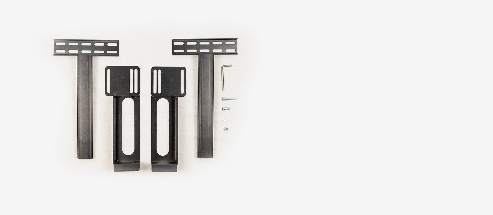 The components of a universal head board bracket kit, including 4 brackets, an assortment of bolt and wshers and an allen wrench tool